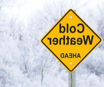 Roadsign reading "Cold Weather Ahead"